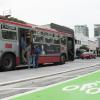 7th Street after: bus riders board Muni bus from a transit boarding island