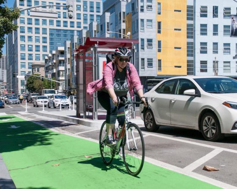 Person riding a bike along 8th street in buffered bike lane