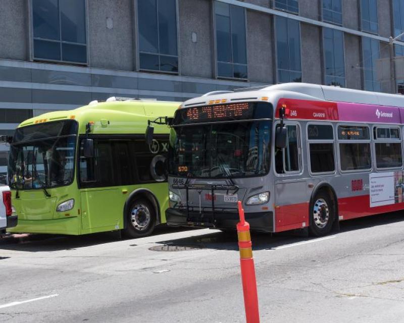 Electric bus and hybred bus in frount of One South Van Ness