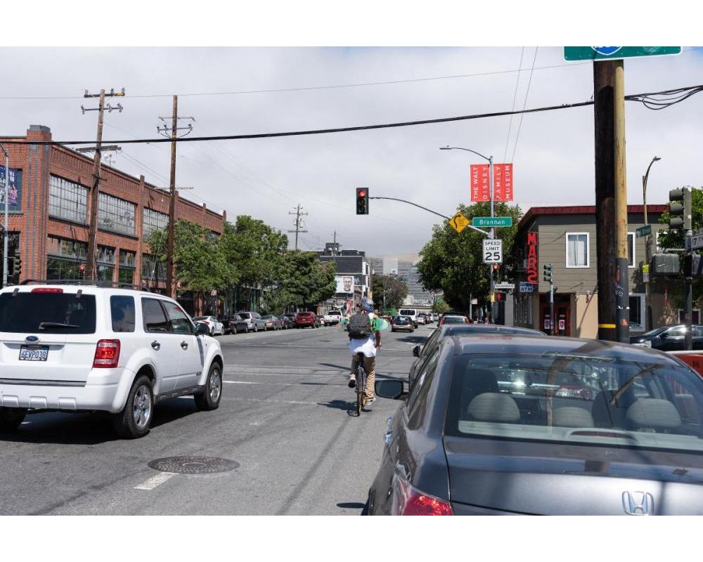 7th Street before: bicyclist riding in faded bike lane