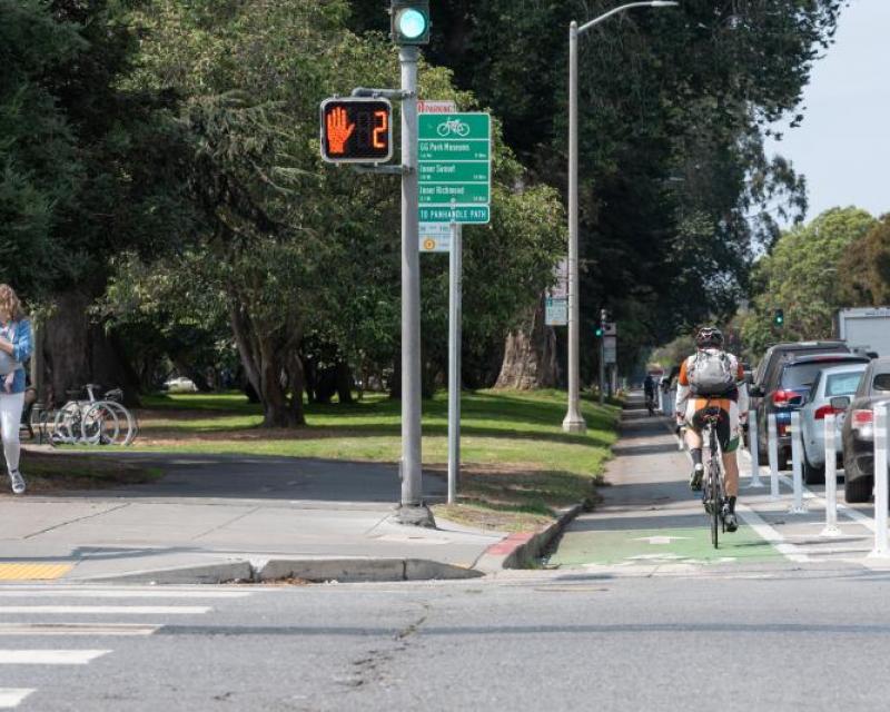 People using protected bikeway on Fell Street 