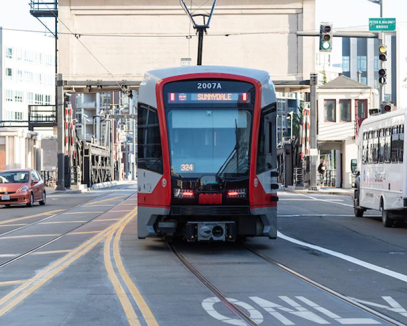 Photo of a Sunnydale-bound T Third train approaching the 4th Street Bridge
