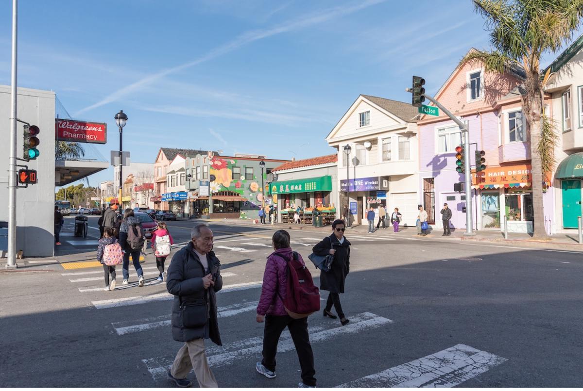 Image of people crossing the street on San Bruno Avenue Image of people crossing the street on San Bruno Avenue