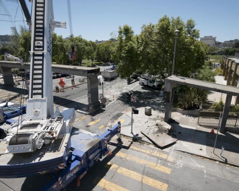 Image of cranes and crews removing the bridge at Geary and Steiner
