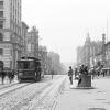 Looking west on Market Street from 3rd Street with a cable car on the left and a waiting station on the right in January 1906.