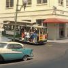 A cable car passes the Cable Car Barn at Washington Mason after completed restoration of the building in July 1965.